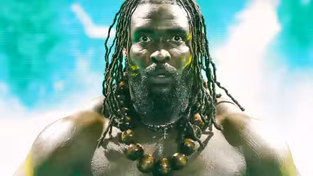 Oba Femi looking straight ahead with his eyes wide